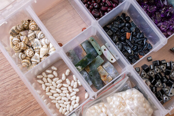 Colorful beads in containers close up, handicrafts