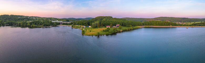 Panoramic view on the reservoir Bostalsee at Nohfelden in Germany. - obrazy, fototapety, plakaty