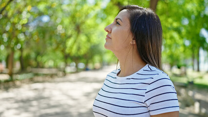 Middle eastern woman smiling confident looking up at park