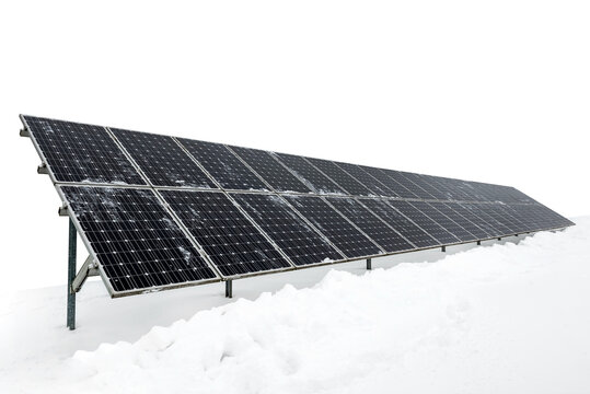 Solar panel in winter in the snow on a white background. Alternative solar energy. Green Energy