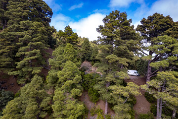 Couple traveling by camping car exploring the best things to see and do on the Island of La Palma in the Canary islands