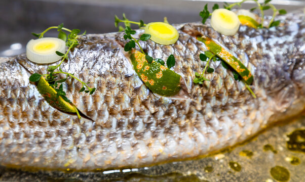 Traditional mullet fish ( Mugil cephalus, Chelon labrosus, Agonostomus monticola, Liza ramada or Mugil curema). Roasted tainha fish.