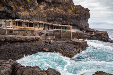 Coast of La Palma in the Canary Islands - Waves off the Atlantic Ocean hit the cliffs of volcanic...