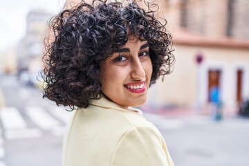 Young middle east woman excutive smiling confident standing at street