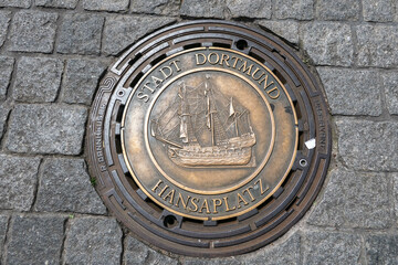Dortmund, Germany, May 29, 2023, Dortmund city sewer plate with a boat