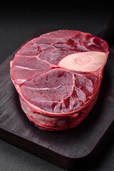 Fresh beef ossobuco steak with salt, spices and herbs