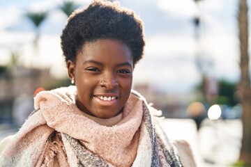 African american woman smiling confident standing at street