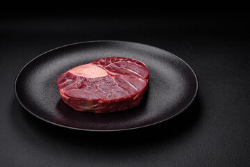 Fresh beef ossobuco steak with salt, spices and herbs