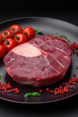 Fresh beef ossobuco steak with salt, spices and herbs