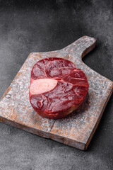 Fresh beef ossobuco steak with salt, spices and herbs