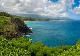 View of the North Shore on the Island of Kauai, Hawaii. One of the most popular resort areas is located on the north shore of Kauai including Princeville. The Pacific Ocean is the star of this area.