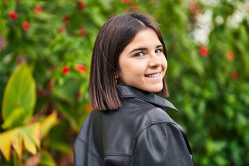 Young beautiful hispanic woman smiling confident standing at park