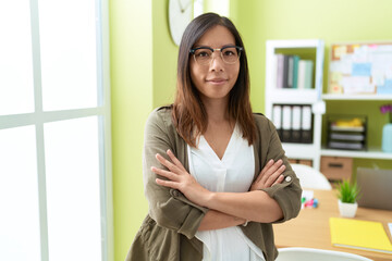 Young asian woman business worker smiling confident standing with arms crossed gesture at office