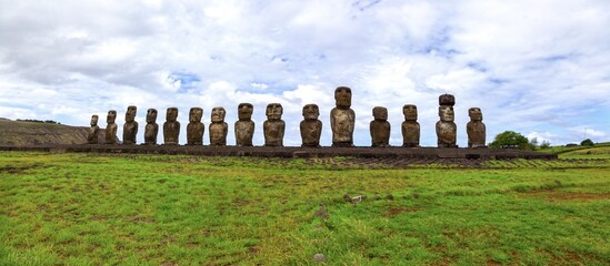 Row of Moai Stone Statues on Platform, Famous Ahu Tongariki Archaeological Site, Panoramic Front View, Blue Skyline. Rapa Nui Easter Island, Chile
