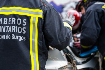 Firefighters extricating trapped victim from the car. High quality photo