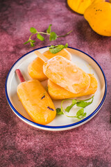 Mango banana popsicles with fresh fruits, flat lay top view