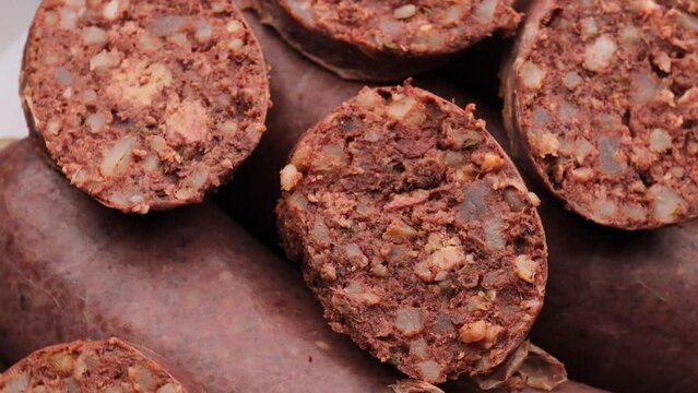  black pudding (kashanka), rotation in circle. pieces of black pudding , close-up , Turning. selective focus.