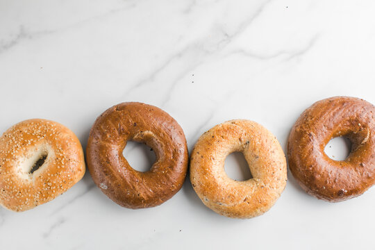 whole grain Bagels with sesame on a marble table