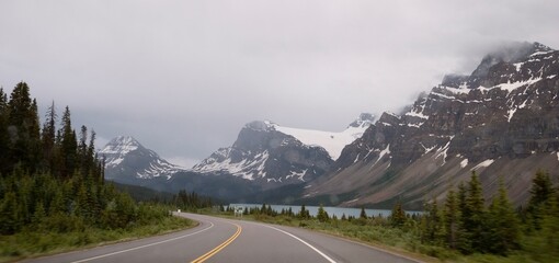 Mountain road on rainy day. Road trip in Canadian Rockies. Banff.  Alberta. Canada