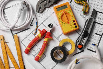 Different wires and tools on electrical schemes, top view