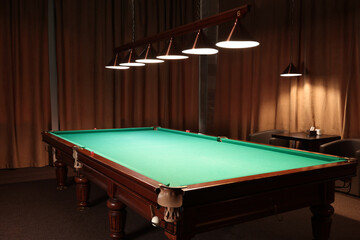 Empty green billiard table in club. Pool Game