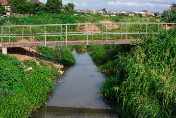 Fototapeta na wymiar A bridge across a small river in Ibadan, Oyo on June 2, 2023. The Nigerian economy undergoes transformations following the election of a new president.