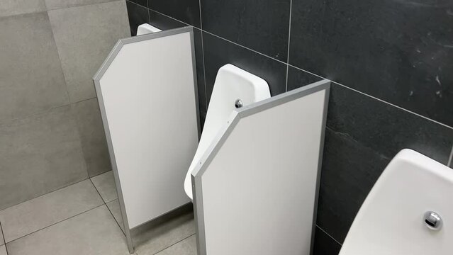 Rows of urinals in a public men's room