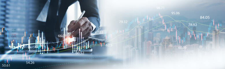 Business development, stock market analysis. Businessman using digital tablet analyzing sales data...