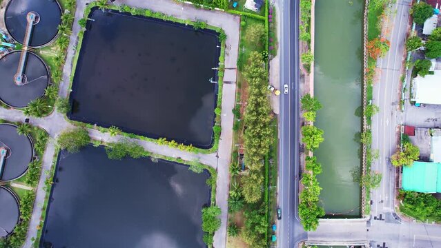 Aerial view High angle view Top down drone shot of the sewage treatment plant.The Solid contact clarifier tank type sludge recirculation in water treatment plant. Industrial wastewater treatment plant