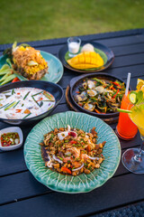Thai food dishes in a restaurant beachfront in Hua Hin, Thailand