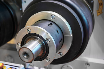 Machine with black hardened steel rollers to roll wire and control panel