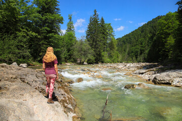 A woman is watching  the water in Kaiserklamm in Aschau, Tirol - Austria