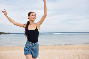Fototapeta na wymiar young woman running leisure sea beach summer lifestyle travel smile sunset