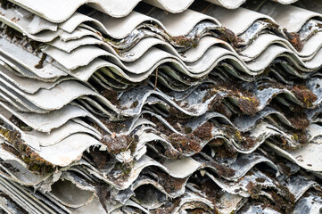 A pile of asbestos removed from an old roof. Hazardous waste prepared for disposal.