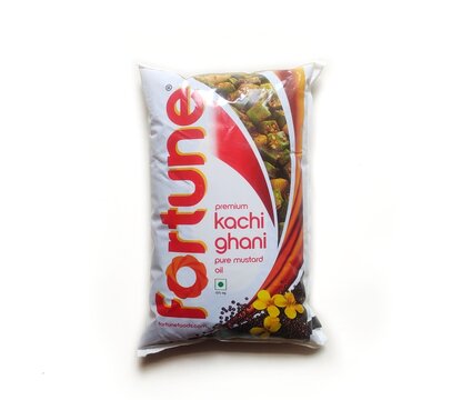 Guwahati, Assam, India - June 8, 2023 : Fortune Premium Kachi Ghani Pure mustard oil pouch in isolated background.