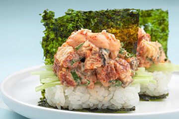 Portion of japanese hand rolls with unagi and sauce