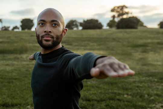 Young, Black man warrior pose 2 yoga, outdoor park, fitness and workout