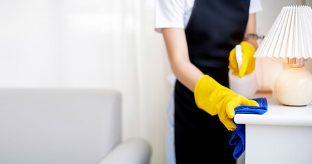 Cleaning Service concept. Cleaners employee removing dirt with equipment in office. Wiping office with cloth and liquid.