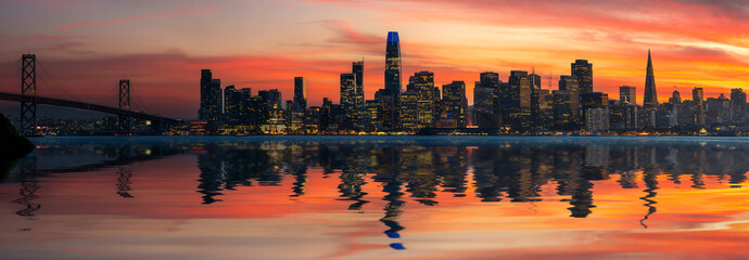 Cityscape view of San Francisco and the Bay Bridge with Colorful Sunset from island
