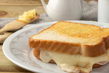 Delicious and traditional toasted bread with cheese and ham.