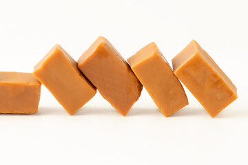 Caramel candies isolated on white background.