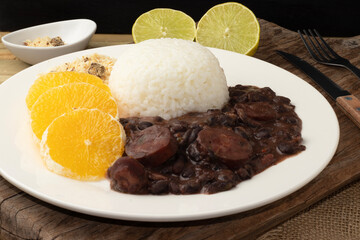Brazilian feijoada executive plate. Selective focus.