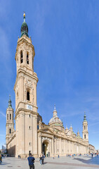 Zaragoza, Spain - May 01, 2023: tourists strolling in the square in front of the basilica of El Pilar in Zaragoza, Spain