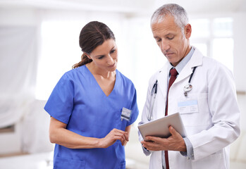 Doctors, man and woman on tablet, analysis or results for healthcare, wellness or teamwork in...