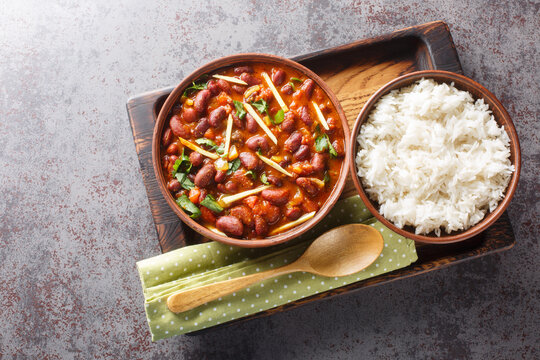 Rajma Chawal is a popular North Indian Food made of Red kidney beans cooked with onions, tomatoes and a special blend of spices, served with Rice close-up. Horizontal top view from above