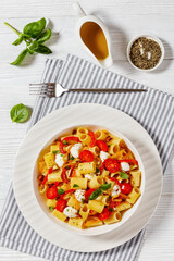 pepper tomato mozzarella pasta salad in bowl