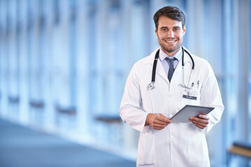 Portrait, healthcare and tablet with a doctor man standing in a hospital corridor for research or...