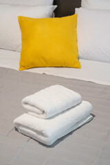 Yellow pillow and sheets 