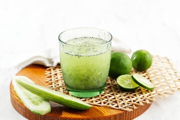 Es Timun Serut, a Typical Indonesian Drink Mde from Shaved Cucumber with Simple Syrup, Lime, and Basil Seeds.