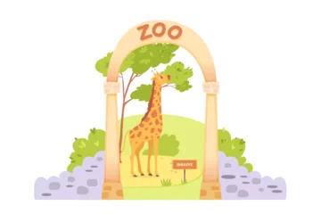 Poster Cute giraffe at open zoo entrance with stone fence, baby animal eating green tree leaves © backup_studio